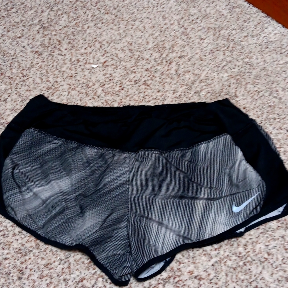 NWOT. NIKE Runner shorts, built-in panties, perfect condition.